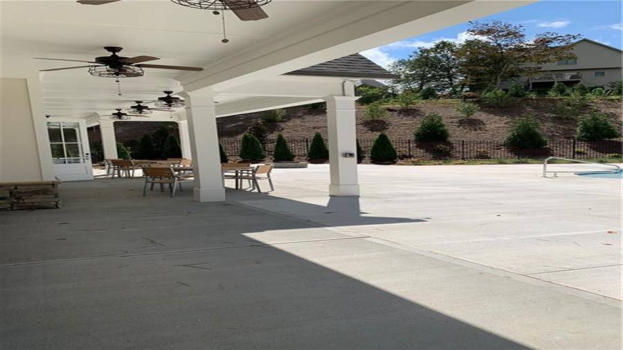 Covered patio of clubhouse stretches the length for plenty of seating with friends and neighbors.