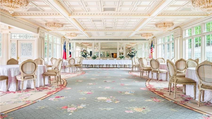 Ballroom set up for a wedding.  Can hold over 200 people.  All tables and chairs come with the home.