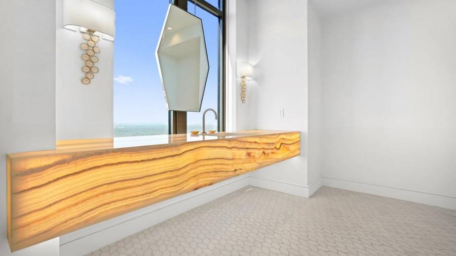 Powder Room with Floating Back-Lit Onyx Countertop and Floating Mirror.