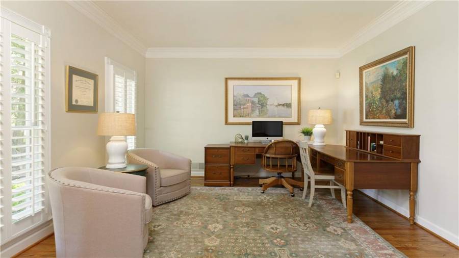 Formal living room or home office with plenty of natural light.