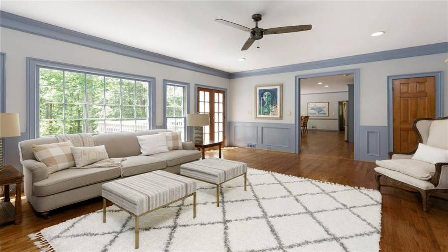 The wall of windows provide picture perfect views of the peaceful and private backyard!