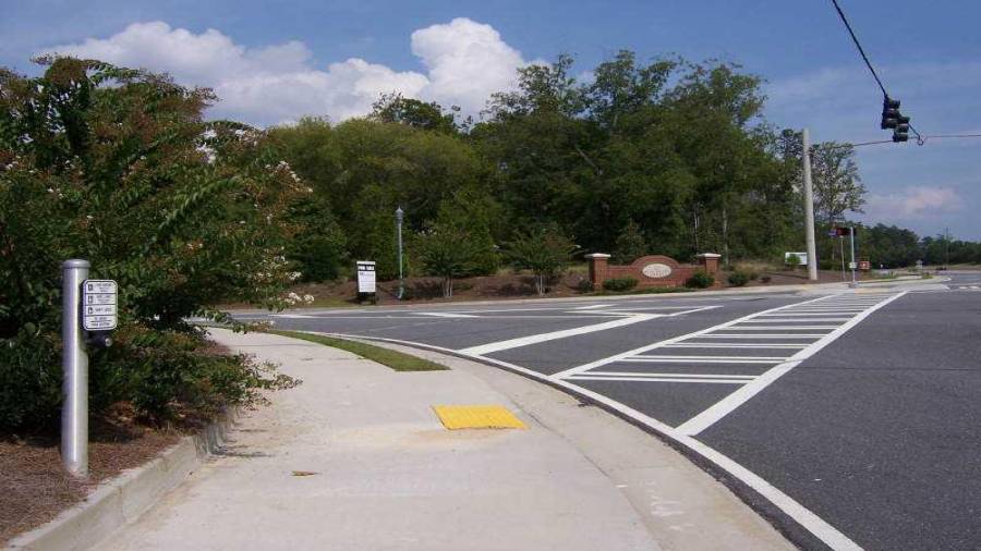 corner 3069 Gravel Springs Rd / Cedar Glade Lane / Mall of Ga BLVD view east to 3053 Gravel Springs Rd, Buford