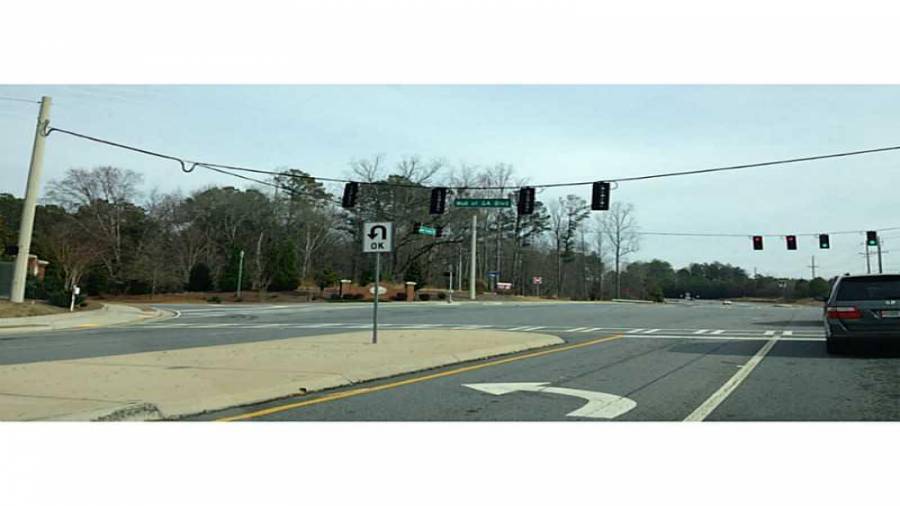 view east from SR 324 & Mall of Ga Blvd (3053 Gravel SPrings Rd, Buford to left) 3053 Gravel Springs Rd site includes all utilities plus curb cuts on Cedar Glade Lane and Gravel Springs Rd / SR 324 - Intersection of SR 324 / Gravel Spring Rd, Mall of Ga Blvd, & Cedar Glade Ln