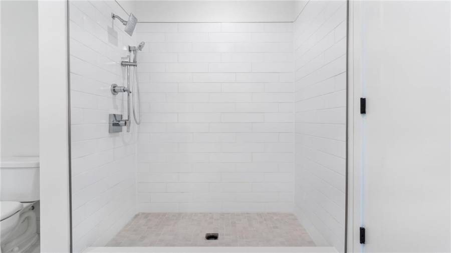 Kholer fixtures; 2 shower heads, frameless glass now installed!