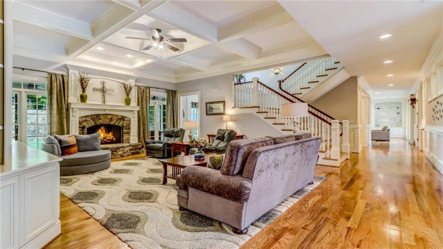 Center family gathering room with beautiful staircase