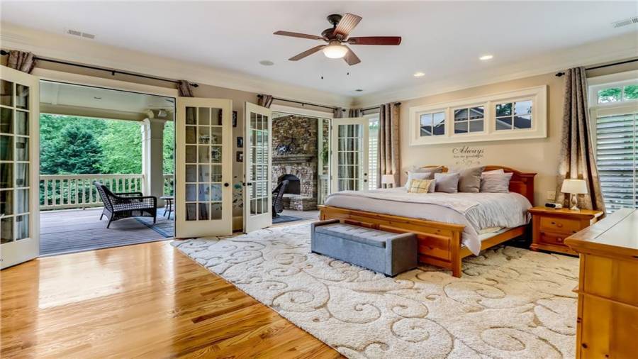 Owners suite with fireplace & river view.