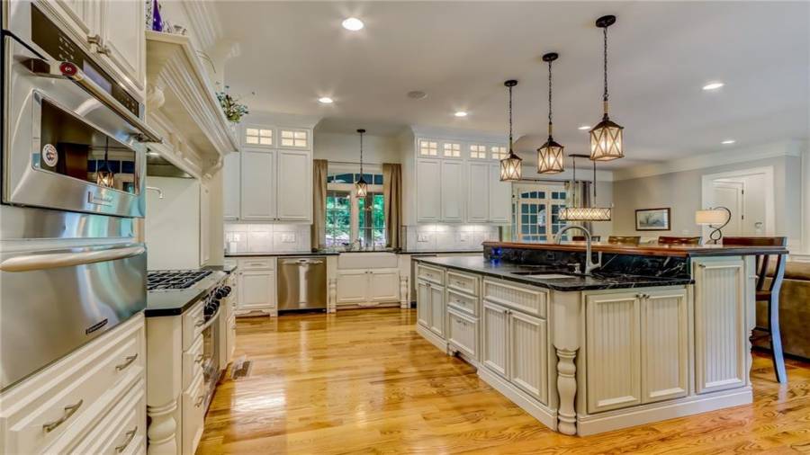 Custom soap stone countertops and bar seating.