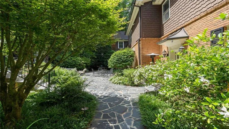 Enter the back through the wrought iron gate.