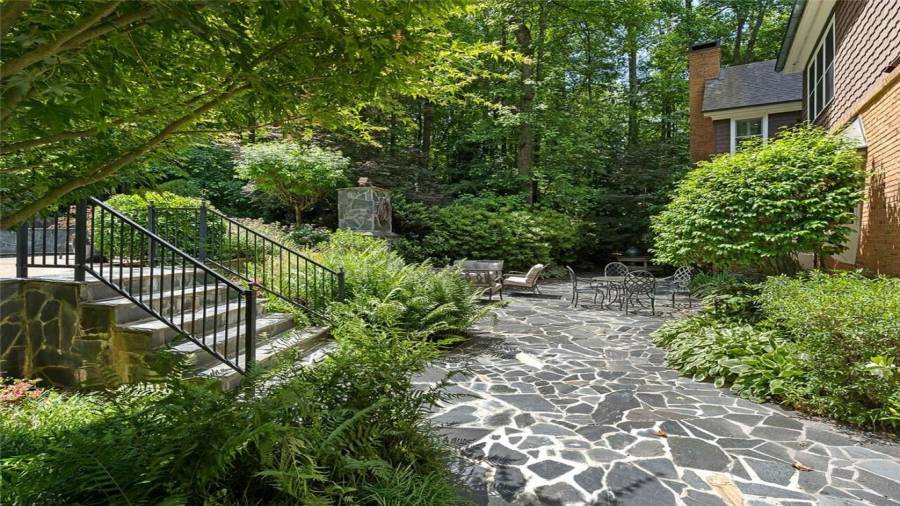 Tiered pool to the left & lovely patio ahead.