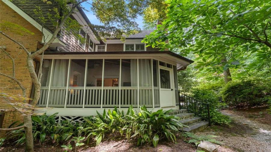 Relax to the summer sounds on your screened porch