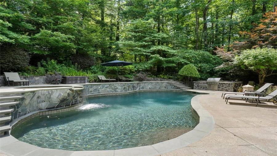 Privacy abounds in this luxurious estate home