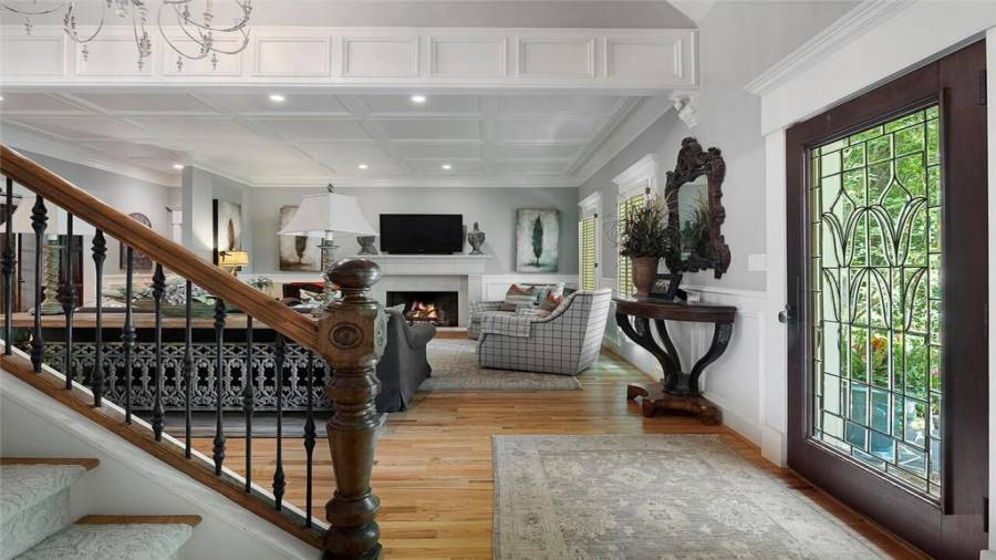 Pass through the custom etched glass mahogany door