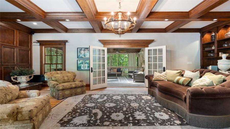 Enter through french doors to the screened porch