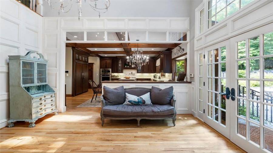 Two story light filled sitting rm off kitchen.