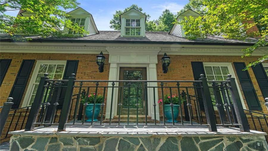 Lovely, light filled two story foyer greets you.