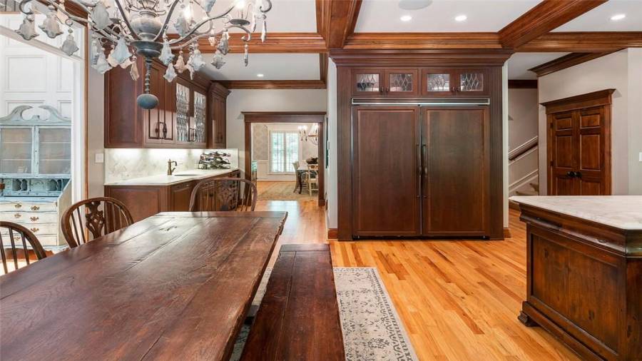 Viking refrigerator w/custom panel & lit cabinets