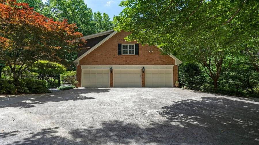 Addtl 3 car attached garage w/half bath for pool.