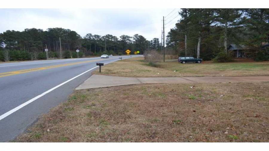 Exterior Front. Looking East down Hiram Acworth Highway from homes front yard