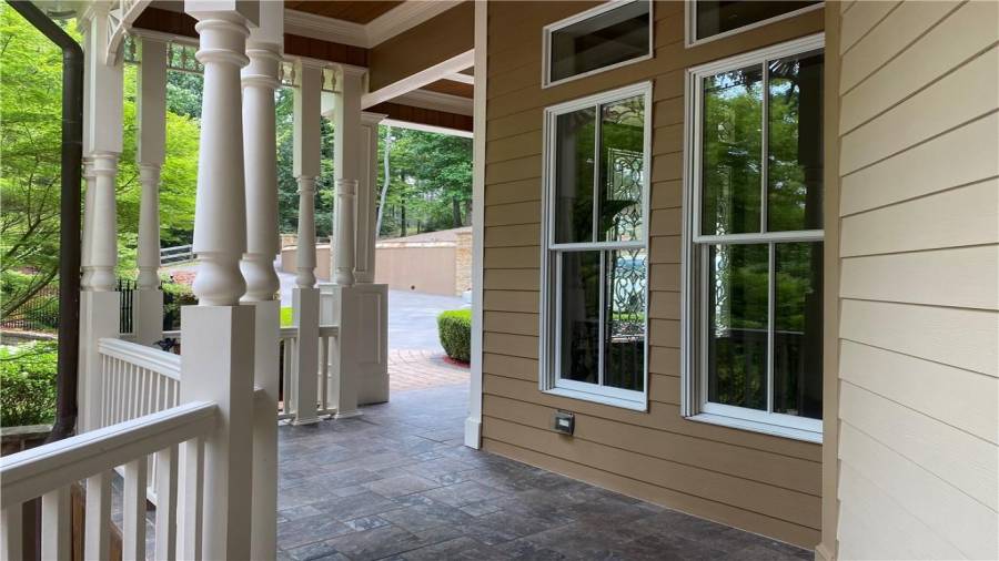 Covered front porch leads you to the 3 car garage. Level walk into the front door.