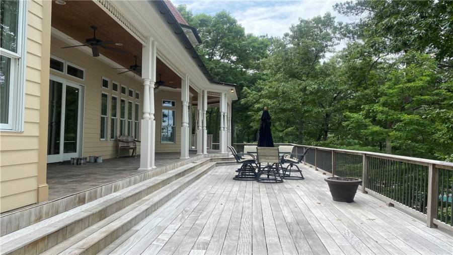 Covered porch off the living room, kitchen and dining area is a incredible place to entertain your family and friends. Wonderful area to watch the sunset or just look out over the water and watch all the action on the lake.