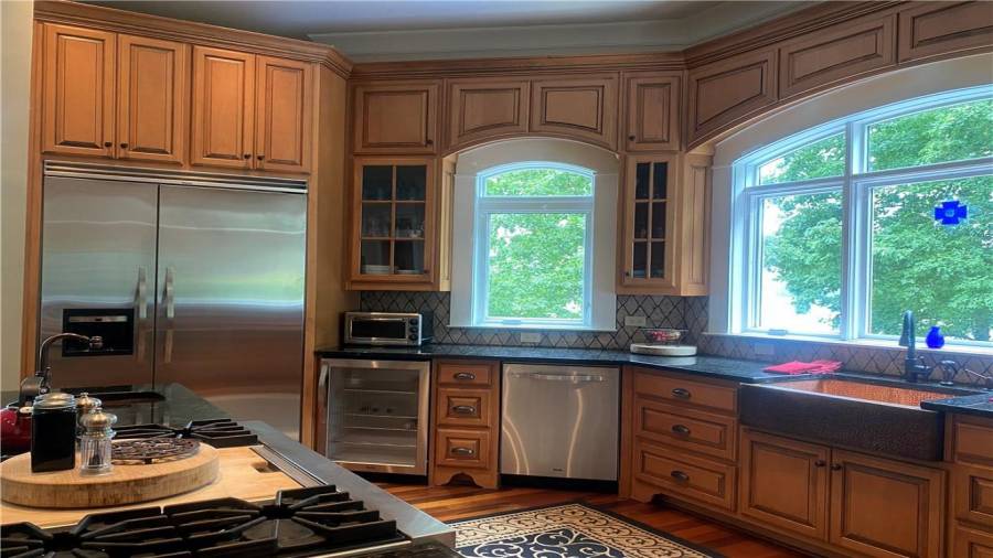 The Chef in the family will really enjoy this kitchen and all the space it offers. Chef will not miss out on any action out side. Lake views from the kitchen windows and views of the entertaining area outside. Plenty of counter space for preparing your favorite meals! Enough room for helpers in the kitchen. This home is wonderful for entertaining.