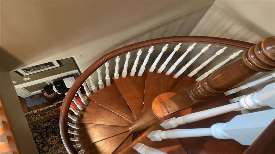 What a custom crafted stair case that leads up stairs. If you do not want to go up the stairs just take the elevator. You can to to all 3 floors.