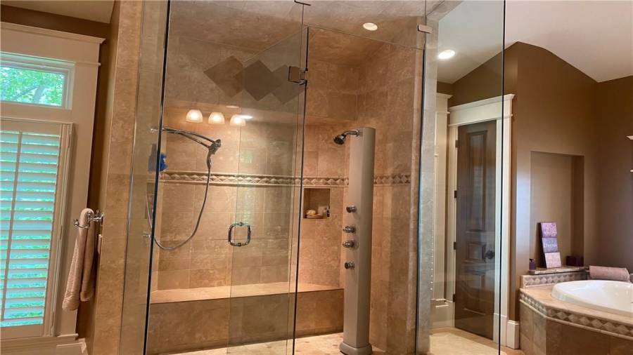 Master shower is huge with sitting area, built in shampoo holder and look at all the shower heads.
