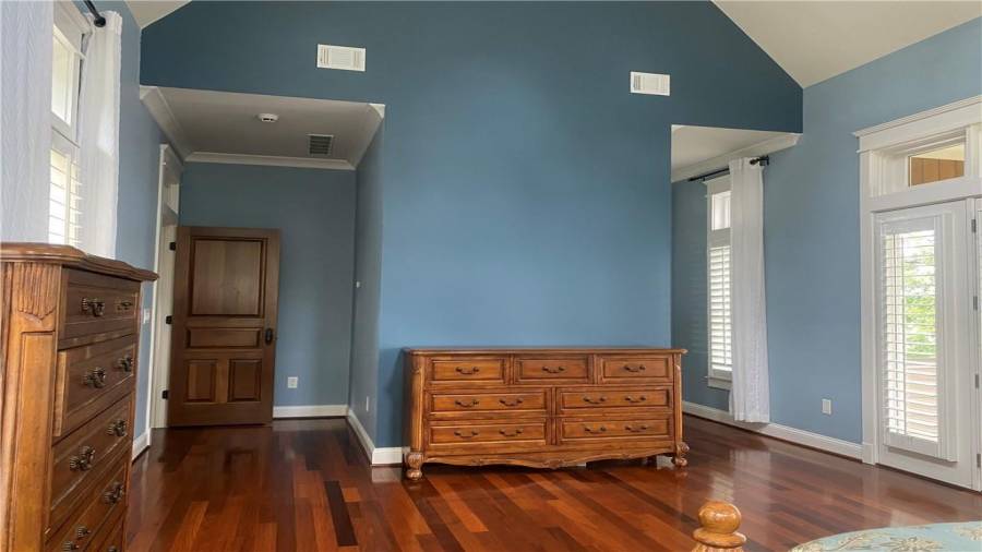 If you are in the blue room in the bed this photo shows how beautiful the Brazilian hardwood floors are. Cathedraceilings. Awesome views of the lake from the wall of windows and doors. This home is solid and built to last.