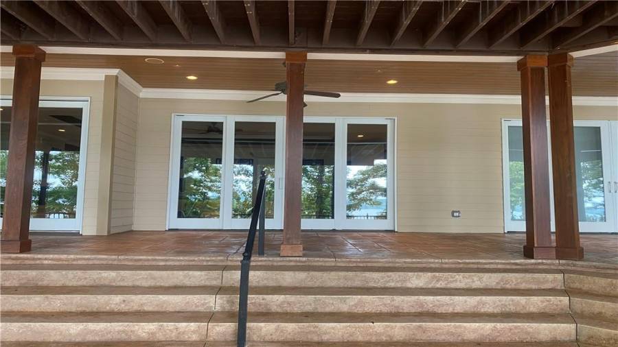 The terrace level offers tiled covered porch. 3 sets of doors. You can access this deck from the theatre room, ping pong table, exercise room or the pool room. Those hot summer nights would be a great place to hang out and listen to the waves. Your so close to the open water you can see and hear the action on the lake. A great place to watch the fireworks on the lake.