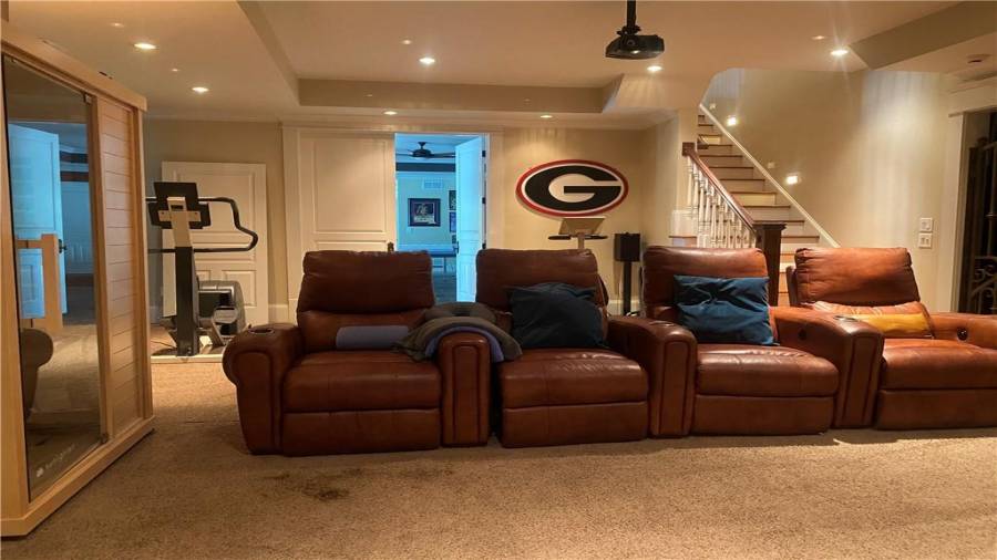 Theatre room has black out blinds. Exercise room.