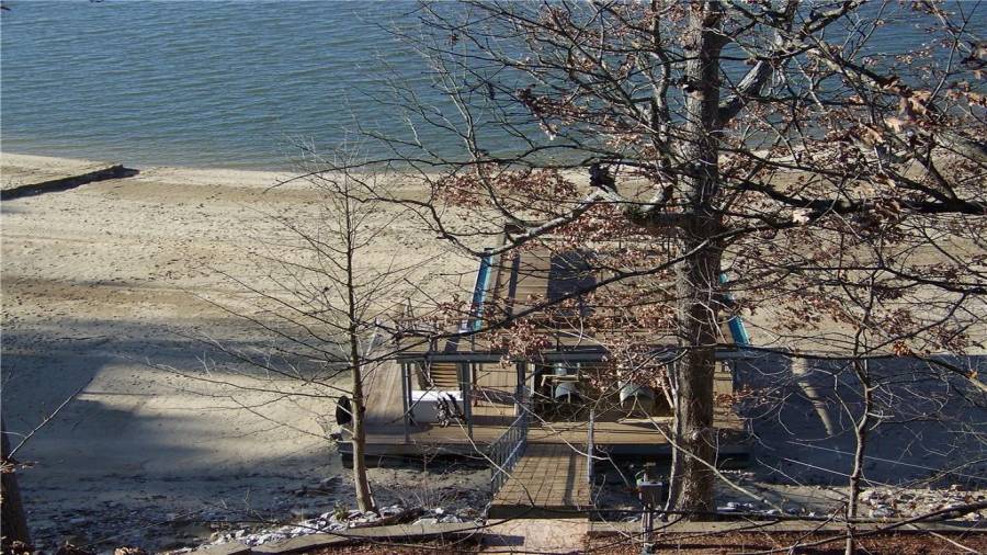 This is the dock is awesome. Single Slip with boat lift. Patio on the top for relaxing. This is the winter water level from approximately  November to February. You could follow the water if you wanted to. The sea wall is in. Watch the sunset and sunrise from the boat dock. In the winter walk the shoreline and play in the sand.