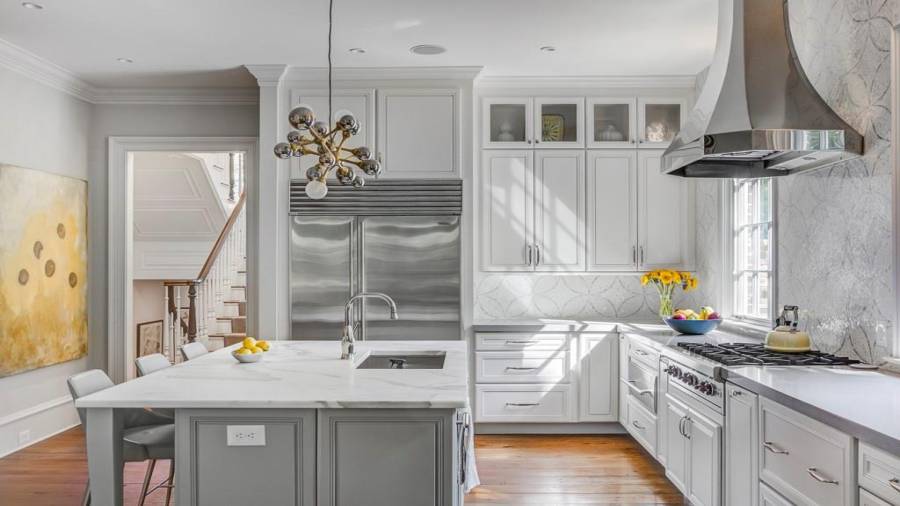 Note the light that pours into this kitchen from the East ... Sub Z refrigerator. with such high ceilings note the glass front cabinets above to showcase decorative items.