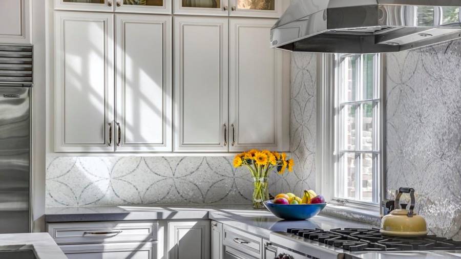 A closer view of the mosaic tile backsplash.