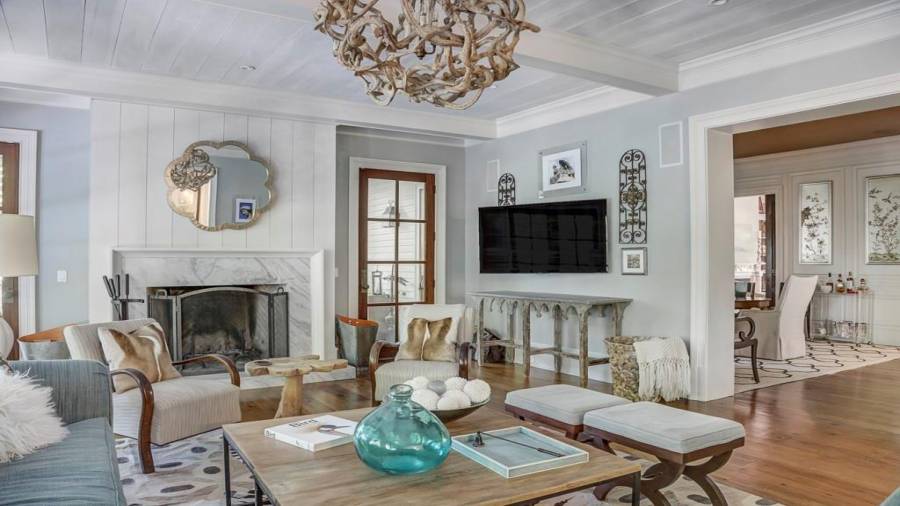 Family room is also open to the dining room, and has a large marble (hearth and surround) wood burning fireplace.