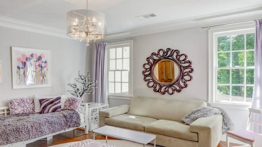 Upstairs guest bedroom overlooks backyard and has ensuite bath.