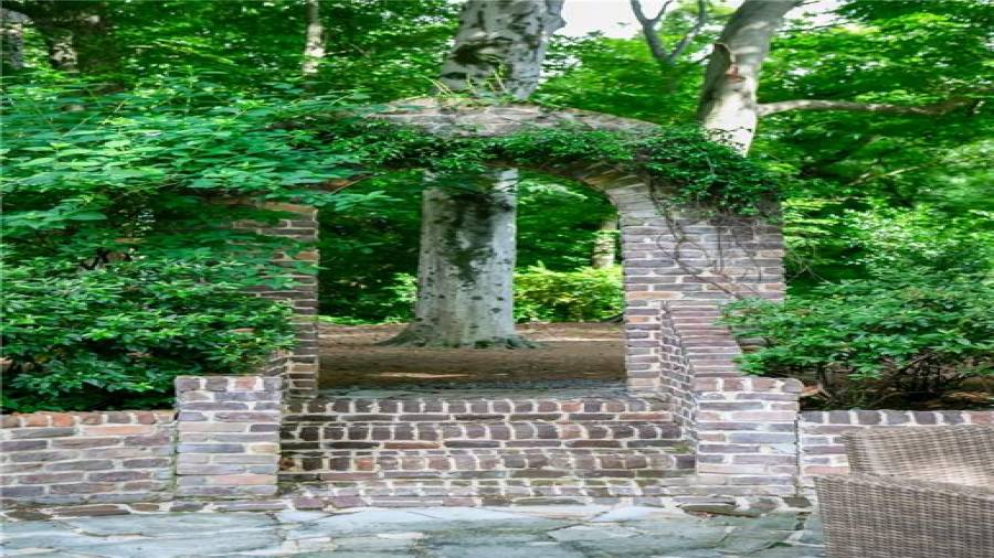So many architectural details like this arched opening to the private back yard from the brick patio.