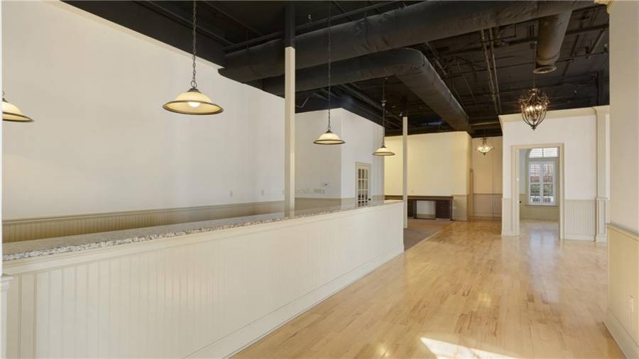 Reception counter to far-side office in office/retail