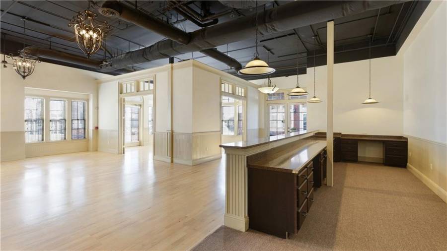 View of the common area and one of the three large offices/segmented retail space