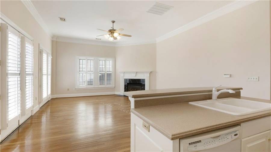Upstairs condo Unit 1 kitchen to fireplace