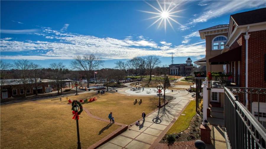 Upstairs condo Unit 1 balcony view of the Town Green