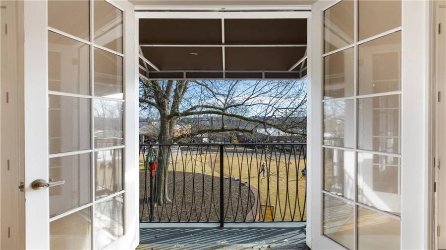 Upstairs condo Unit 2 balcony view of the Town Green