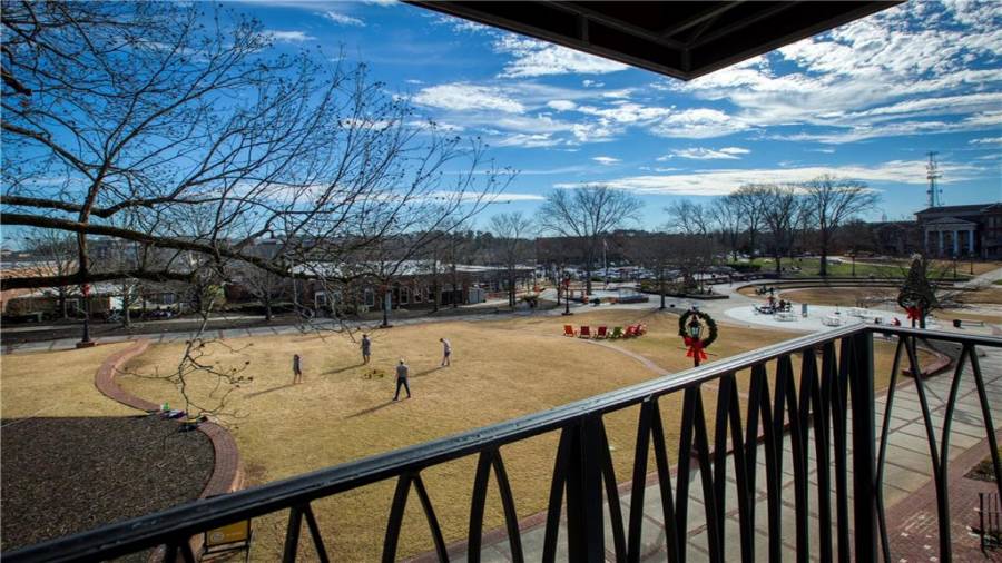 Upstairs condo Unit 2 balcony view of the Town Green