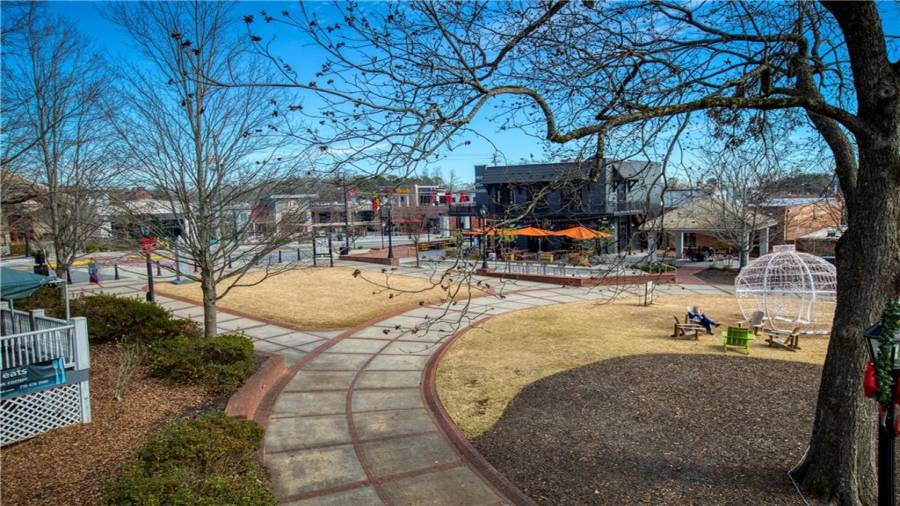 Upstairs condo Unit 2 balcony view of surrounding retail and restaurants