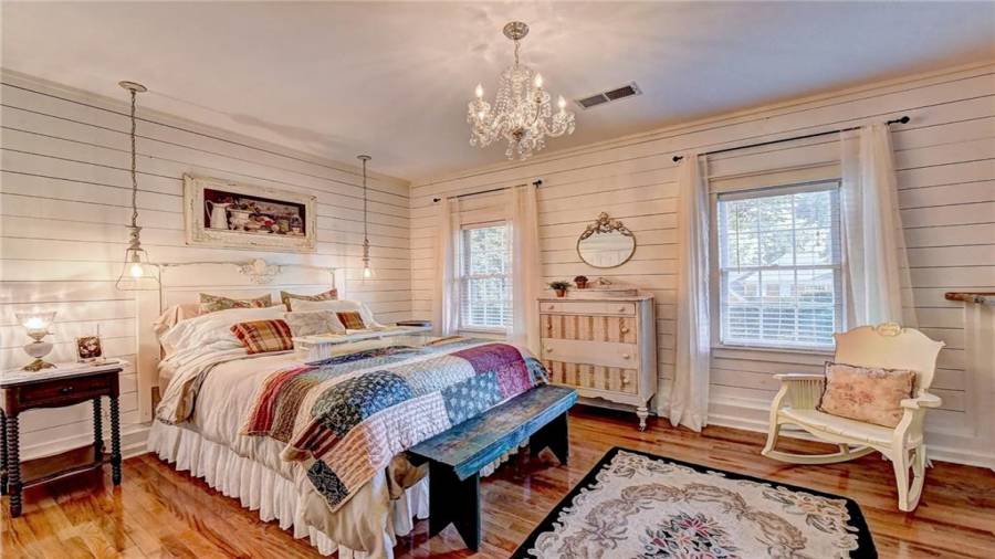 Bedroom on lower level - Shiplap - custom lighting - wood floors