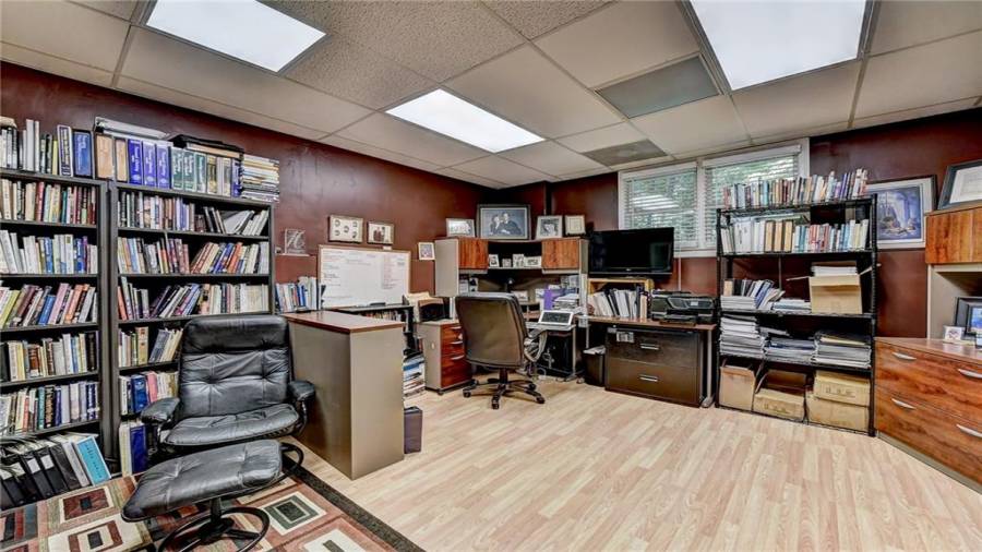 Office on back side of garage - This is basement space. Has window, heated and cooled and exterior door.