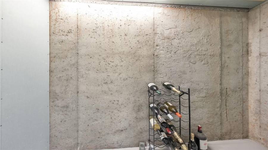 Basement wine cellar with glass door!