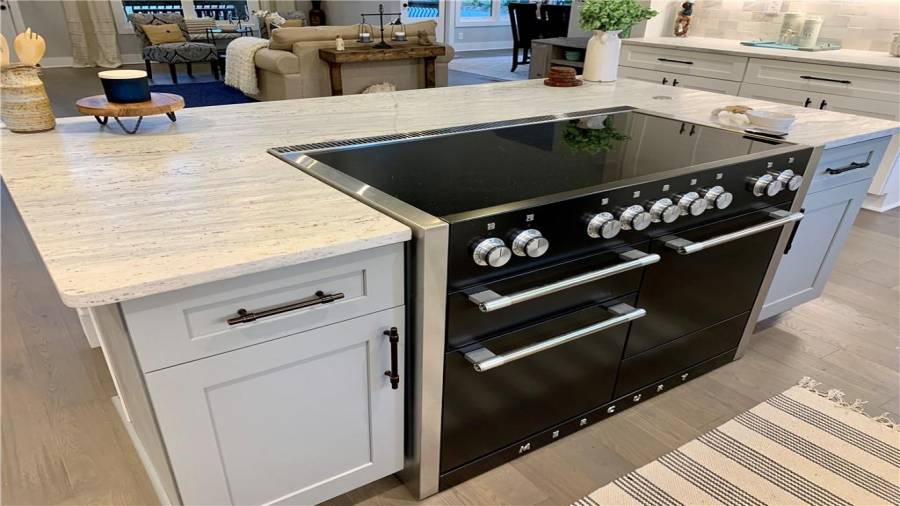 High-end triple oven electric induction range with warming drawer & 5 cooking elements