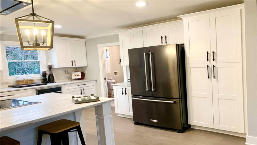 Large pantry cabinet with interior outlet and pull-out tray perfect for storing and using your stand mixer and many other appliances!