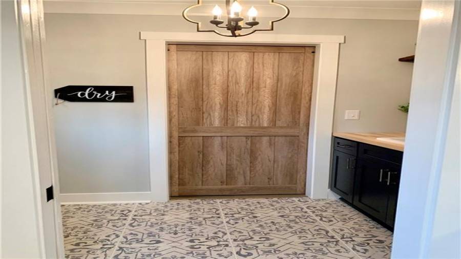 Beautiful chandelier in laundry room