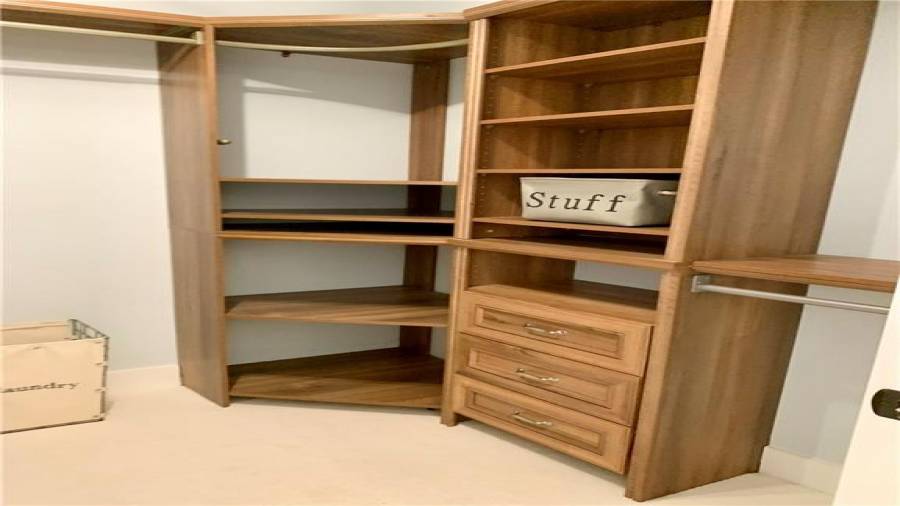 Wrap-around closet towers provide his & hers drawers & shelving/rods. Two valet rods slide out. Maximize hanging space with corner rods inside corner towers